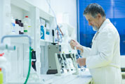 Senior male researcher carrying out scientific research in a lab by Viktor Cap - Stock Photo